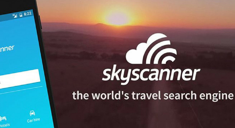 Sunset background with skyscanner logo and tagline underneath