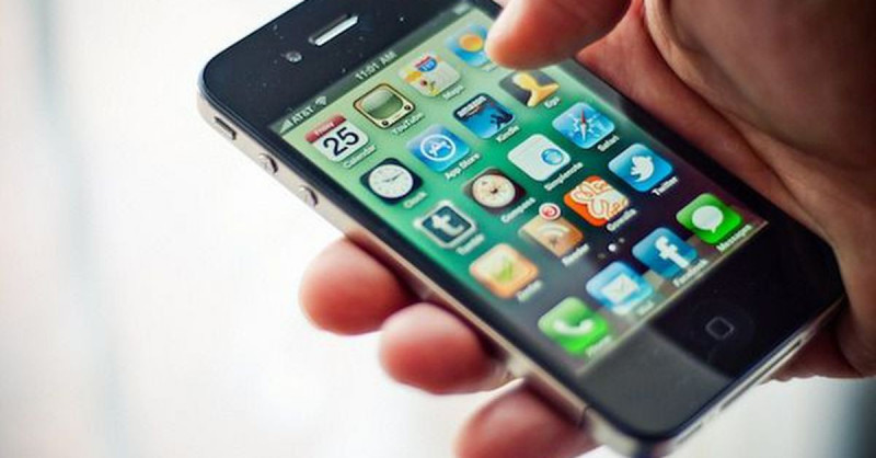 Hand holding black iPhone