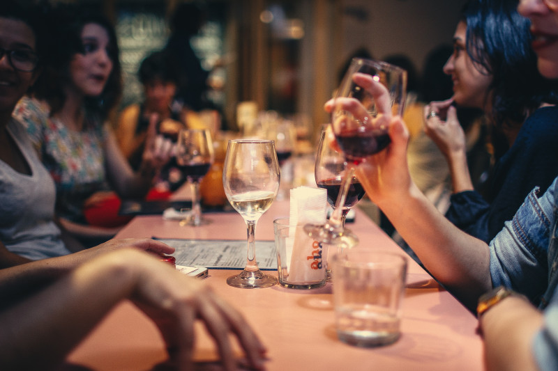 Close up of group enjoying a meal out in a restaurant